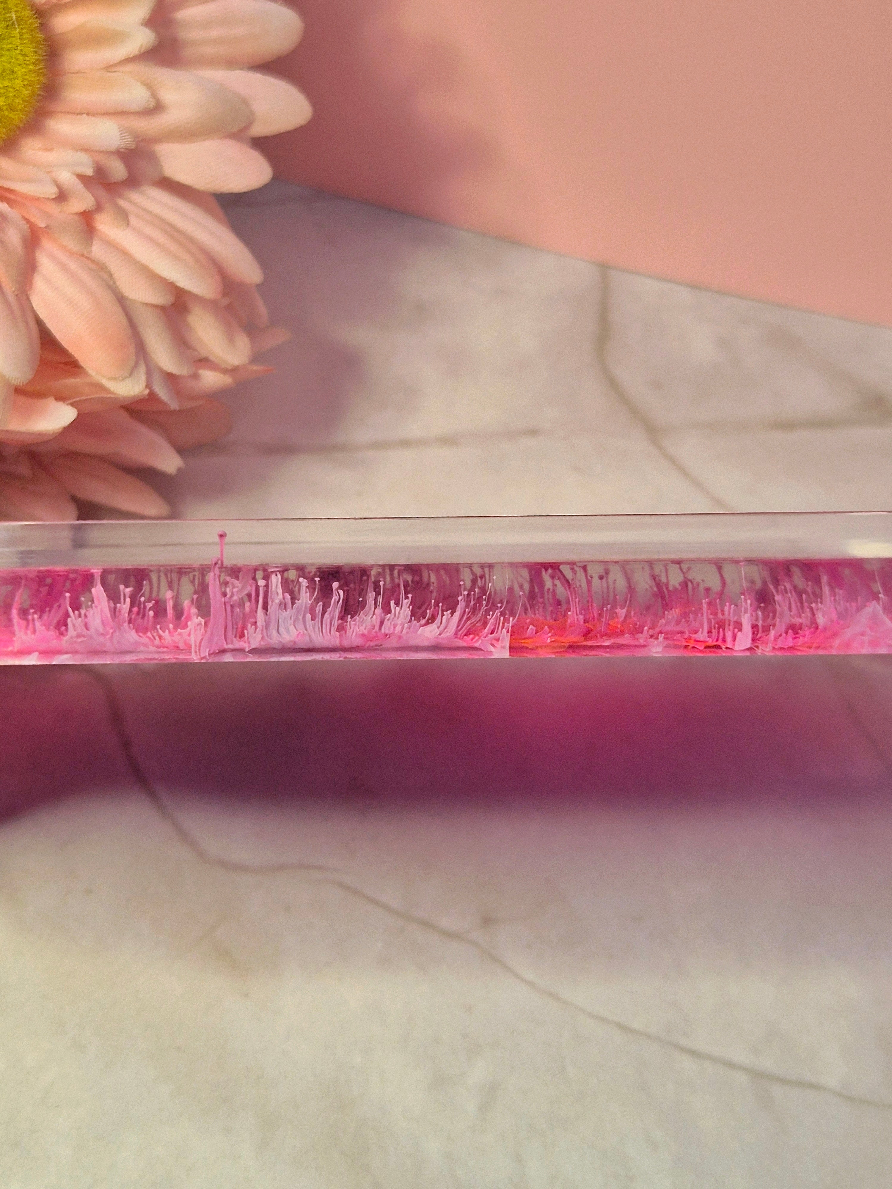 side view petri dish effect trinket tray with coral like ink patterns styed with a soft pink flower