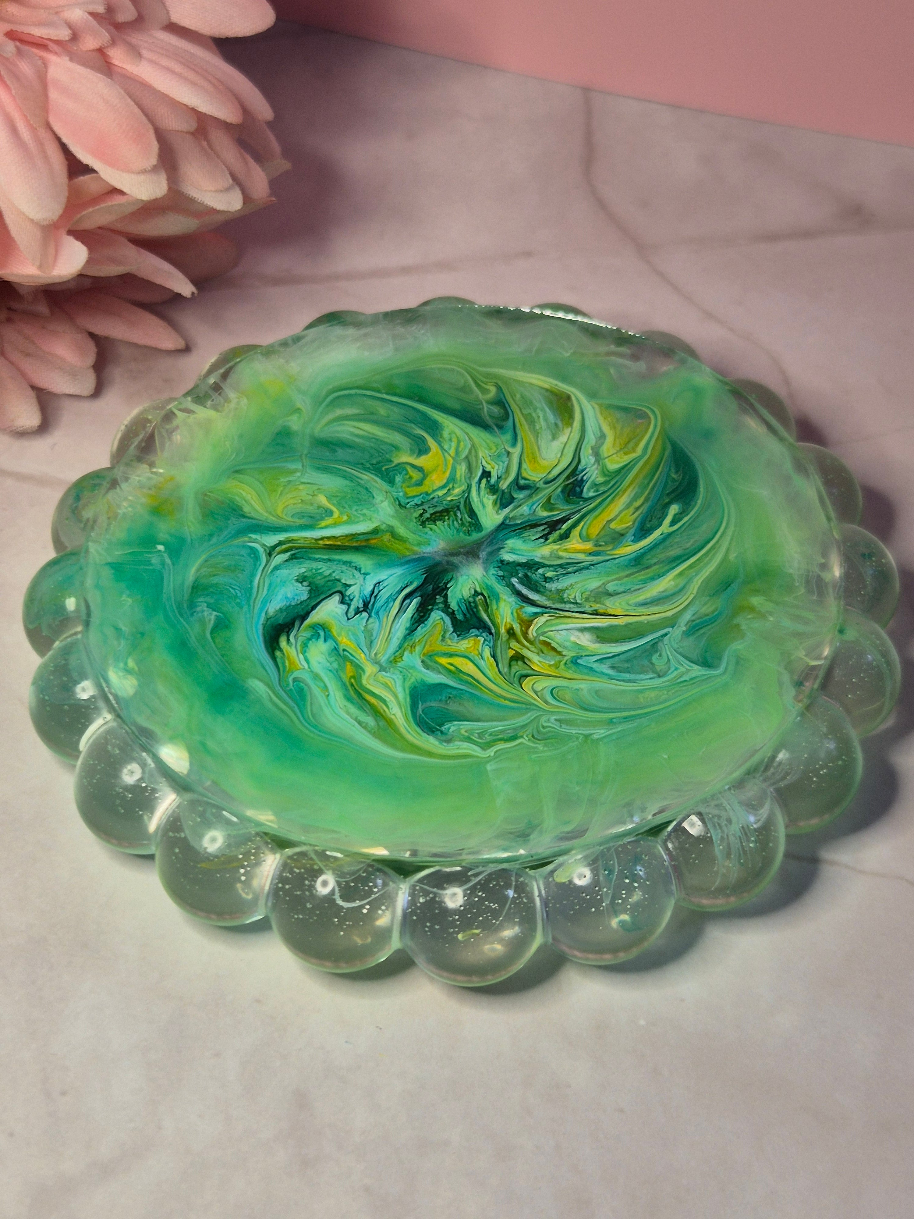 Back of green resin trinket tray with flowing ink patterns throughout