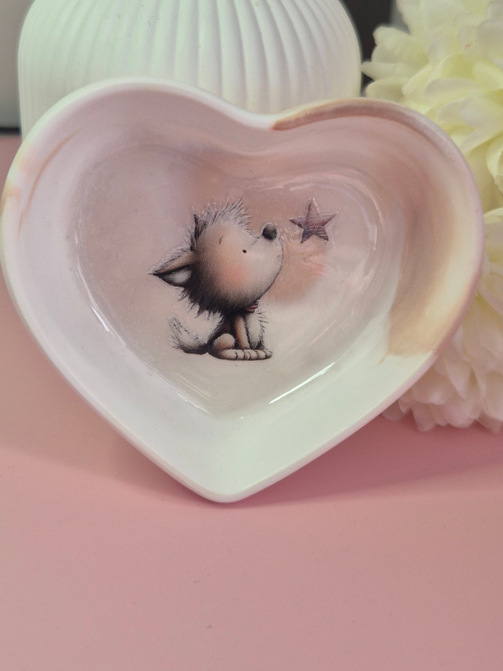 Close-up of the Puppy Wishes Heart Trinket Dish showing the smooth cream swirl finish and puppy illustration inside.