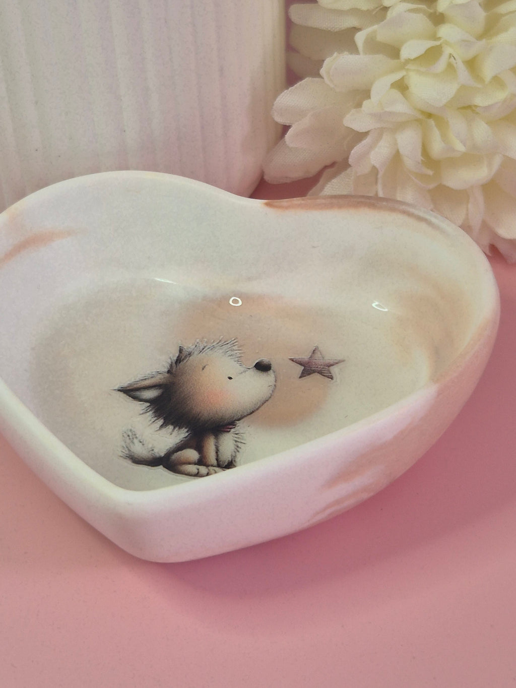 Side angle of the Puppy Wishes Heart Trinket Dish showing its shallow heart shape, smooth sealed finish and soft neutral tones.