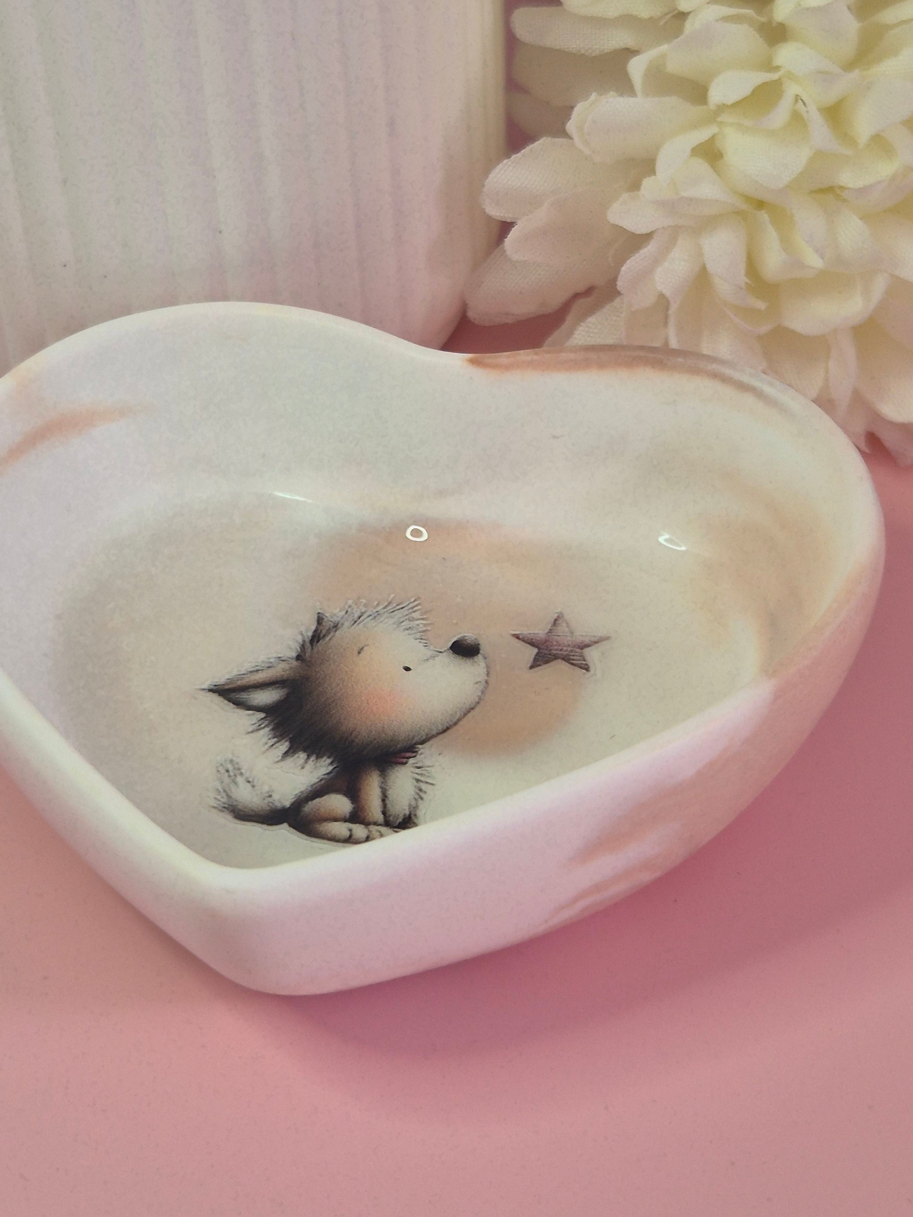 Side angle of the Puppy Wishes Heart Trinket Dish showing its shallow heart shape, smooth sealed finish and soft neutral tones.