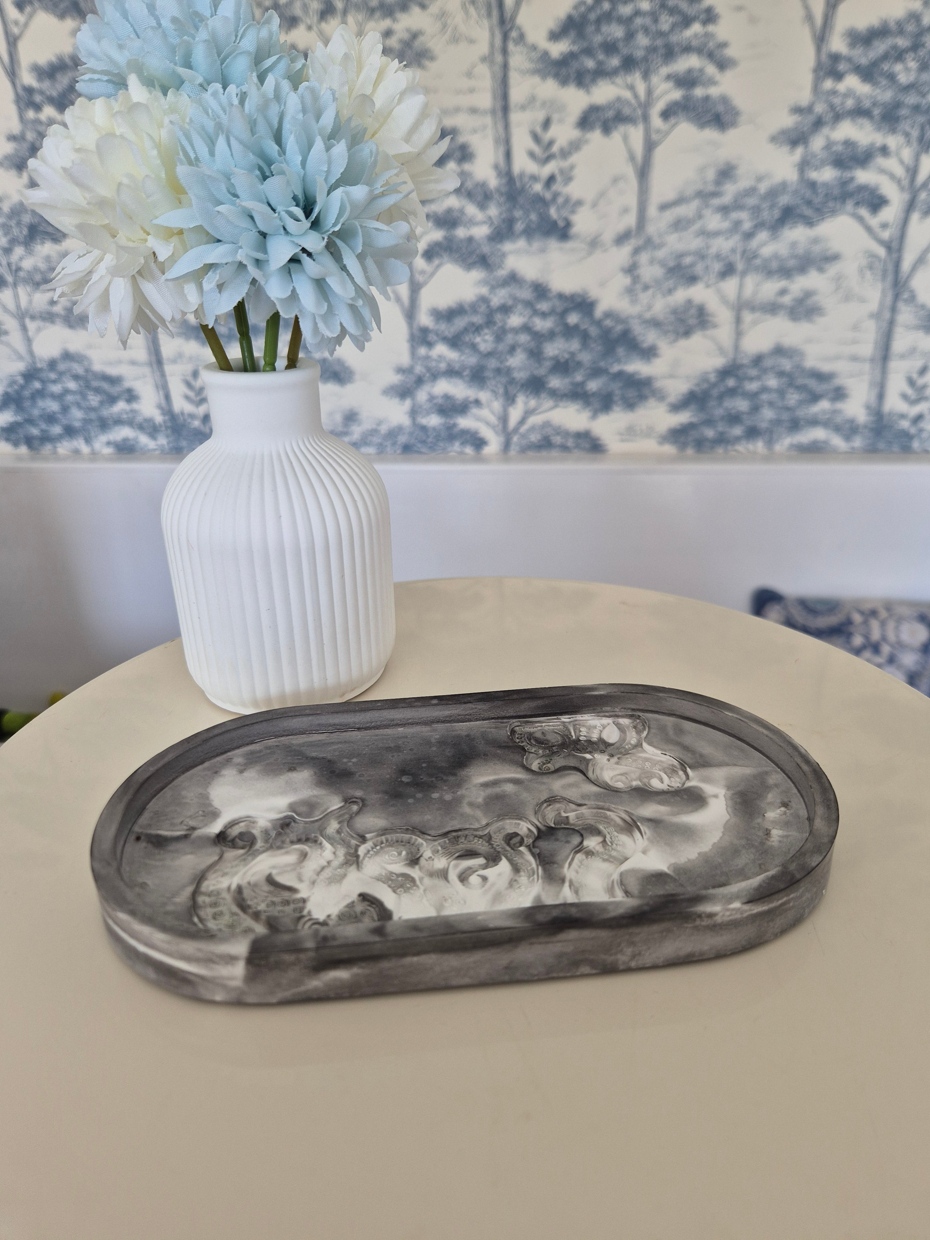 resincrete black & white trinket tray on a table with vase and flowers
